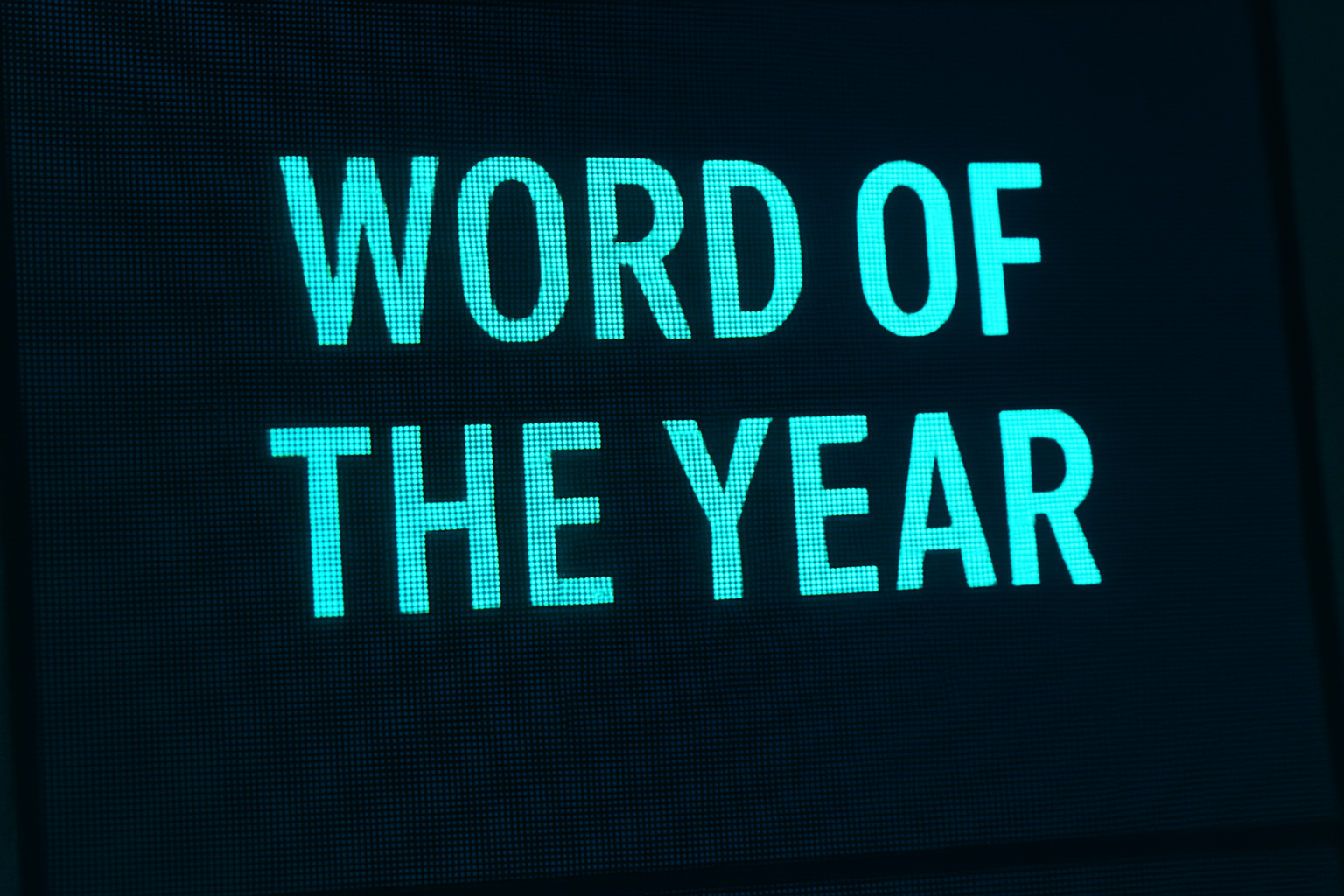 Word of the Year written on a digital screen